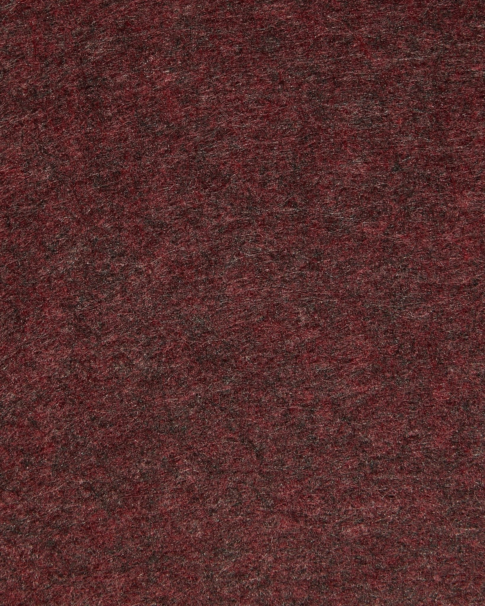 Gros plan sur la WoodUpp Vigg | Felt Box / BM2 en ox red, mettant en valeur le feutre acoustique texturé avec de subtiles nuances et des fibres visibles.